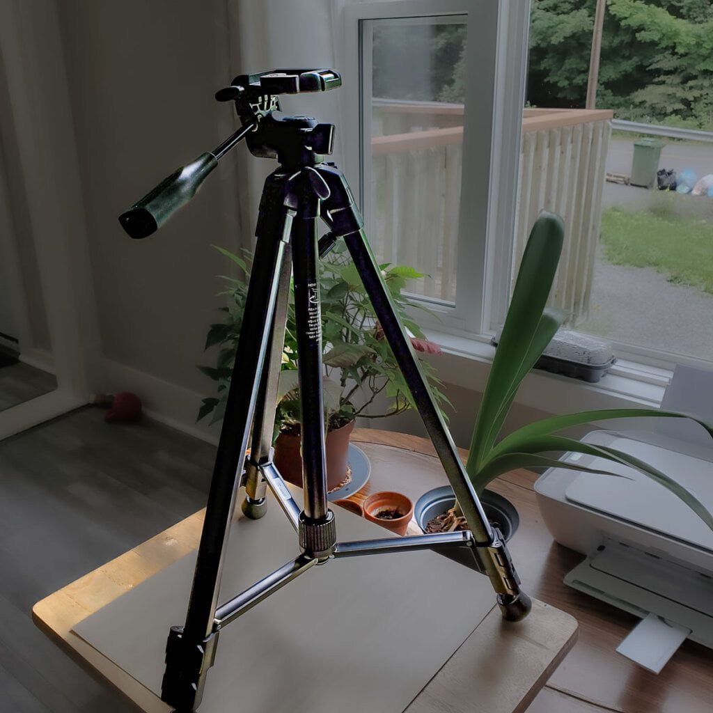 Camera tripod standing but not extended